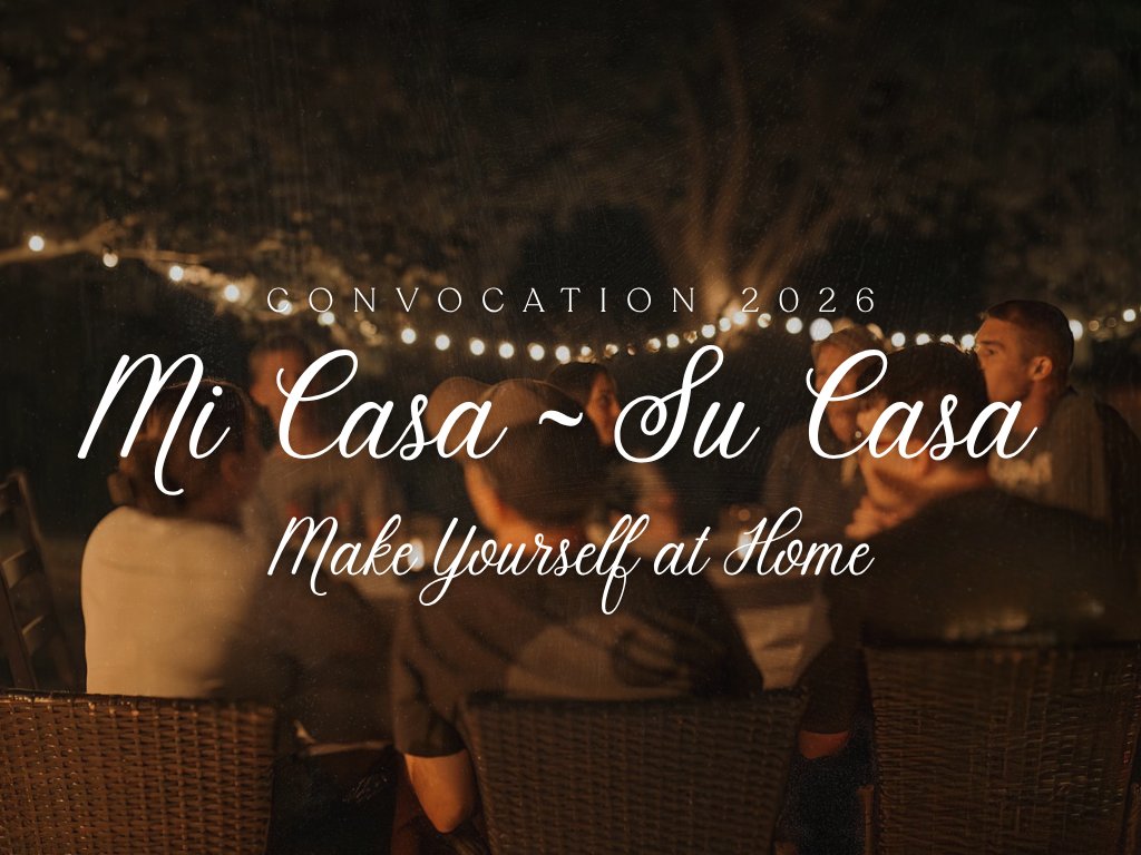 Convocation 2026 — Mi Casa, Su Casa, Make Yourself at Home. Friends gathered around a table at night under string lights.